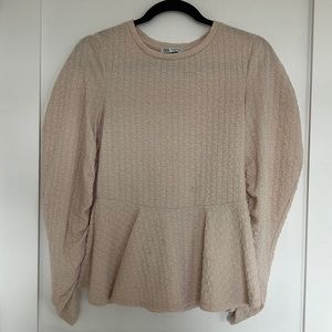 Textured off white peplum with rusched sleeves